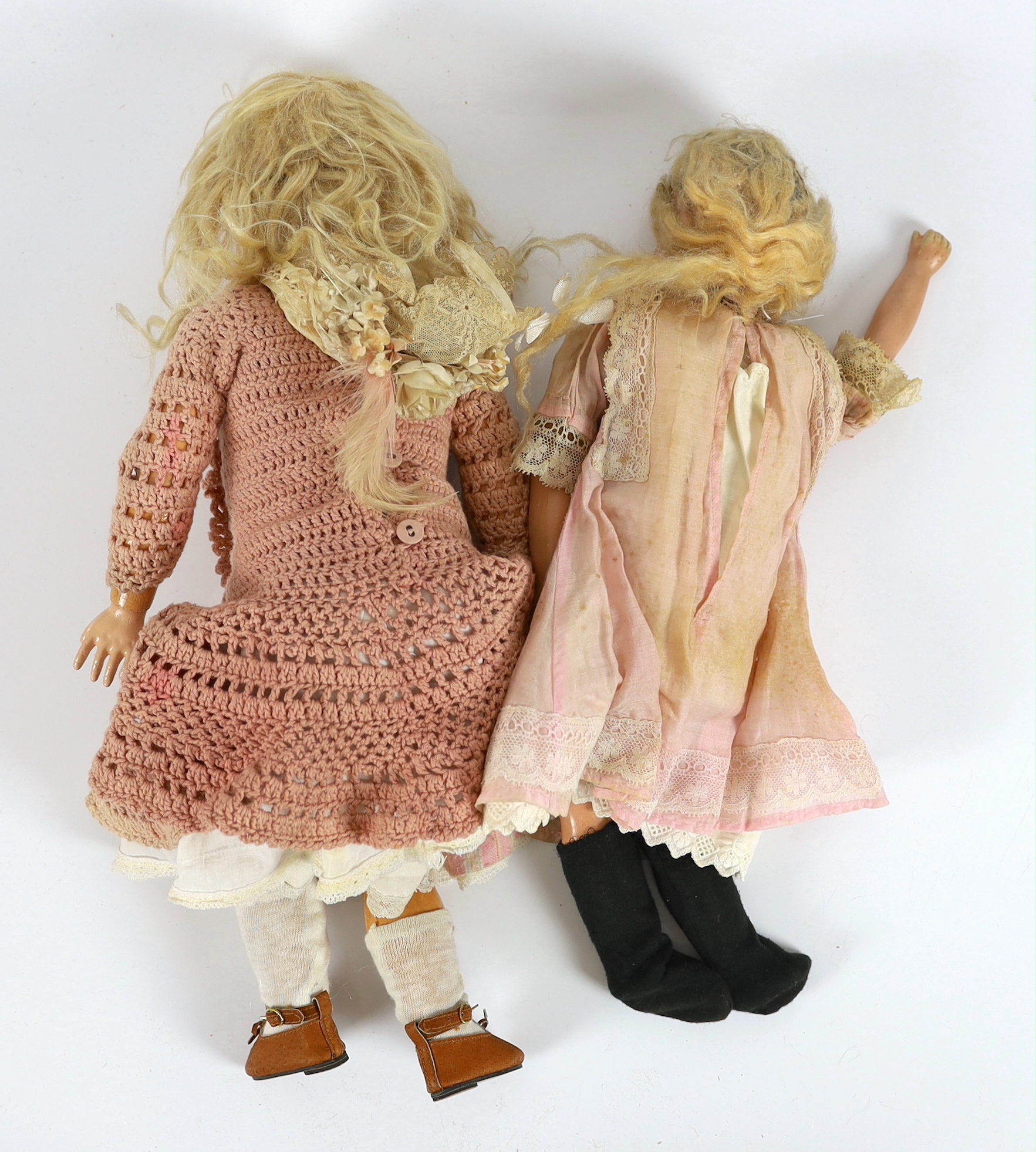 An AM 390 on jointed body with original dress and wig, 50cm, together with an English doll soft body, 45cm